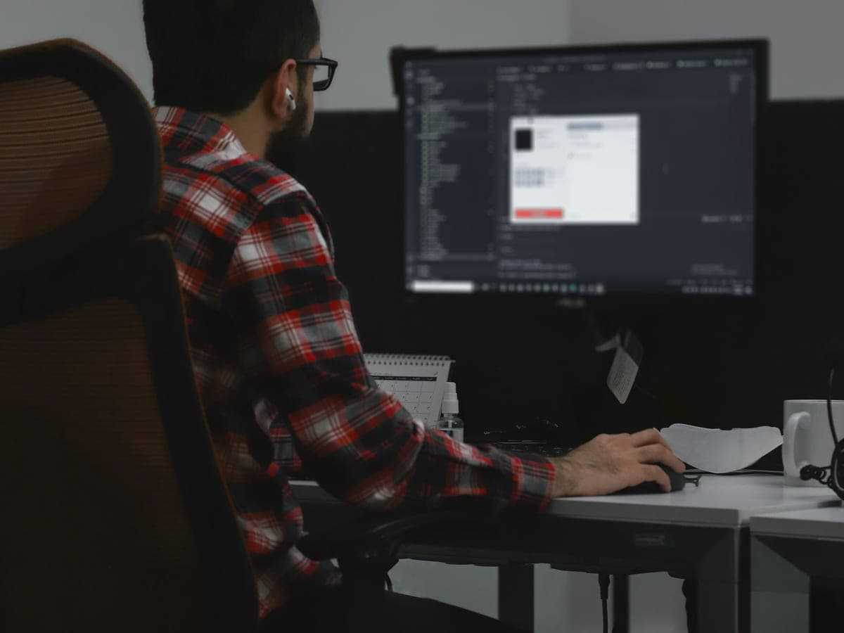 An employee working on a business application in an office